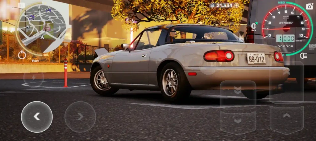 Silver convertible car racing through an urban environment in CarX Street